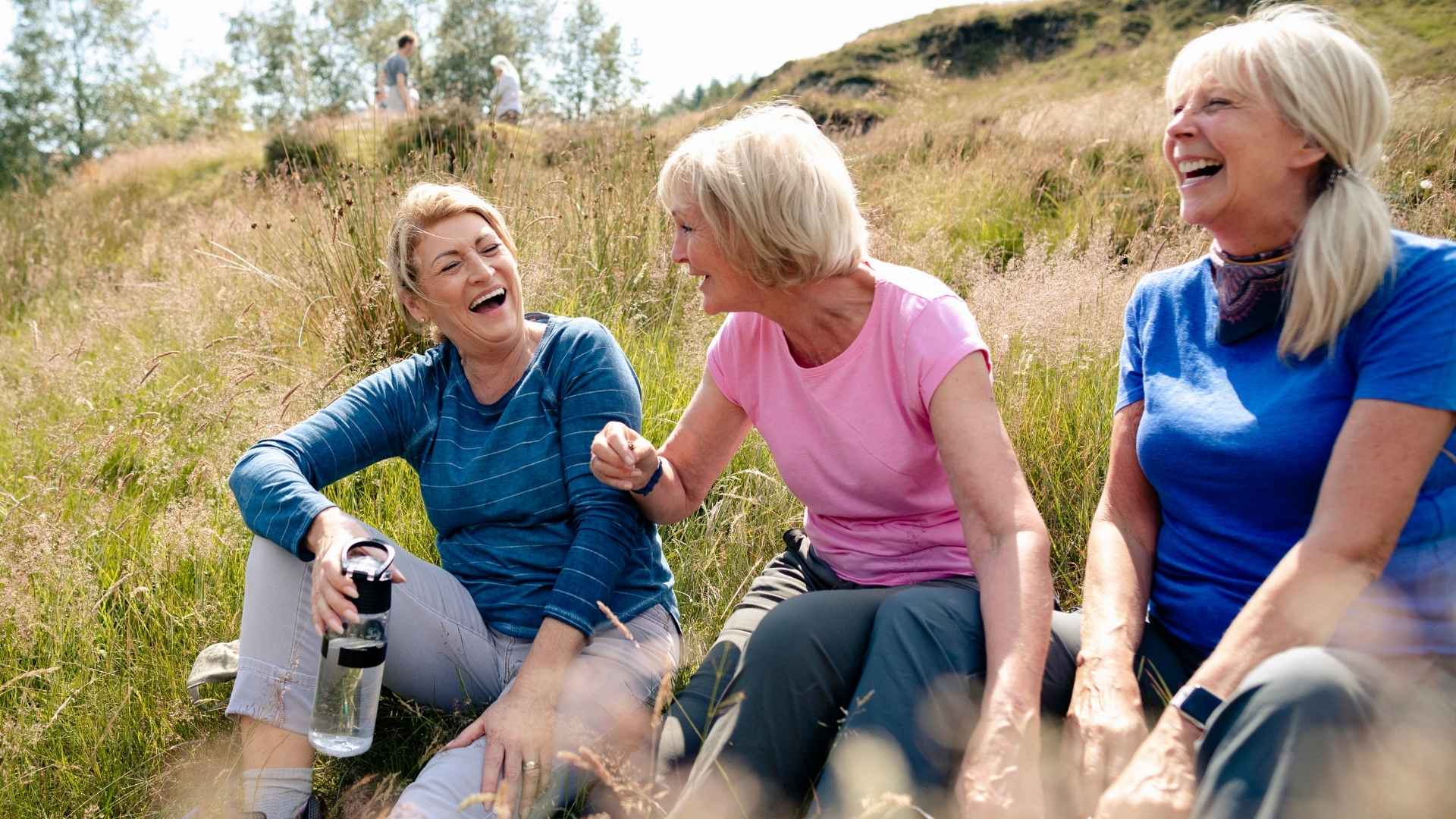 Women taking a break form hiking and laughing